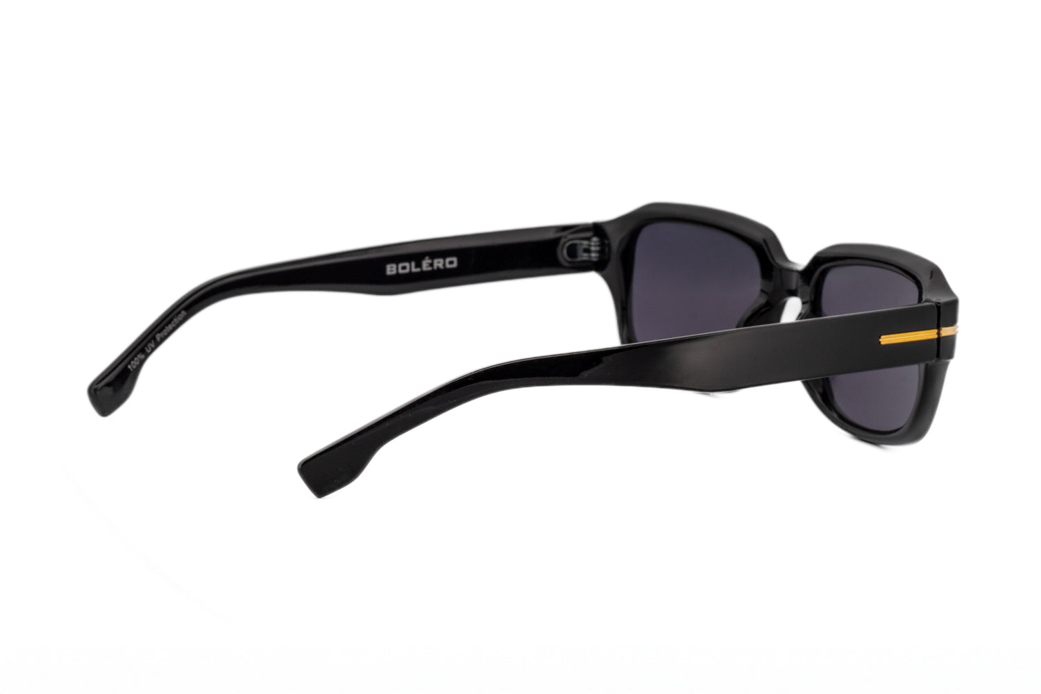 Rhea by Bolero Eyewear slim rectangular sunglasses in black acetate with UV protection lenses rear three-quarter angle view