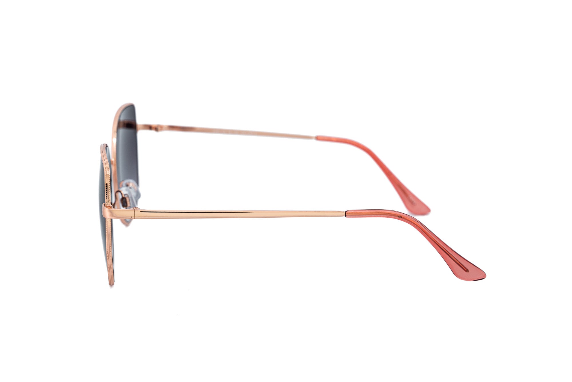 Solea sunglasses by Bolero Eyewear with rose-gold metal frame and smoke gradient oversized lenses side angle view