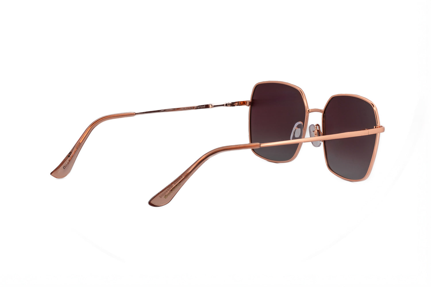 Celesta by Bolero Eyewear rose gold  square sunglasses featuring polarized rose gradient lenses rear three-quarter angle view